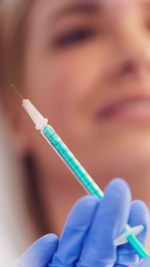 Beautician Or Doctor Preparing Female Patient For Botox Injection